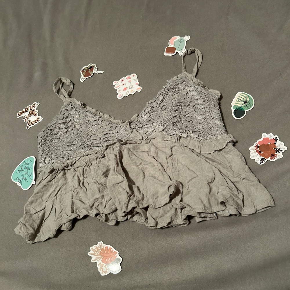 sage green top with lace and ruffle details